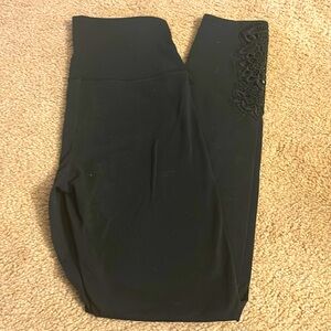 Aerie. Size small. High waisted black leggings with lace detail at the bottom.